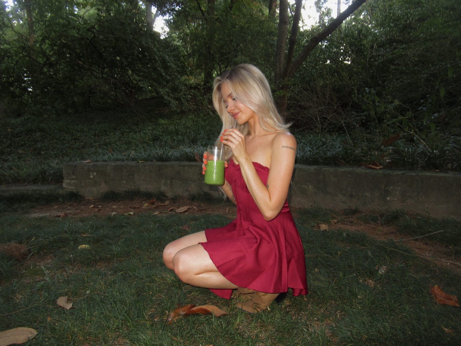 Merima Makelja holding a matcha drink outdoors